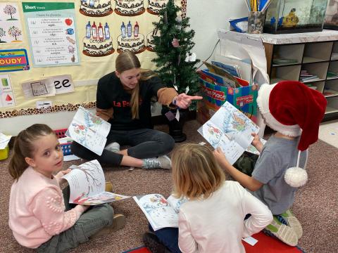 The SFHS girls soccer team came and read with some of our students today about kindness and sharing.  Each student also received a book to take home and read with their families.  Thank you girls for bringing some Christmas cheer to our school!