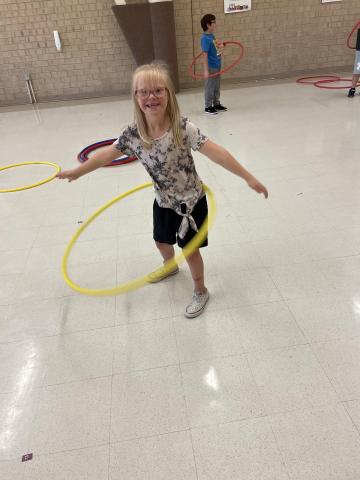 Mrs. Mackay's class had a lot of fun in PE class.  They enjoyed playing with hula hoops and making different shapes with them.  