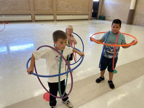 Mrs. Mackay's class had a lot of fun in PE class.  They enjoyed playing with hula hoops and making different shapes with them.  