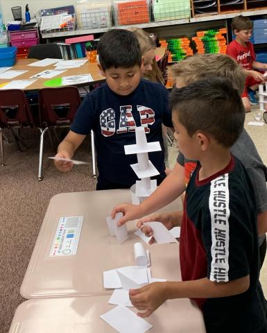 Students competed to build the tallest tower out of only 3x5 cards. It was amazing how tall they got.  They also had to work to stack cups without touching them. They could only use strings and rubber bands. 
