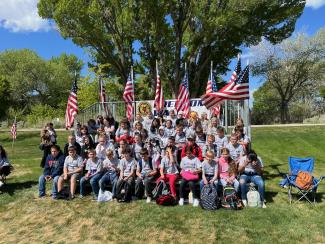 Our 5th graders participated in the Freedom Walk today to honor veterans from all branches of the military.   Each student chose a family member or friend that has served or is currently serving our great country.  They then wrote a report about their lives.  Their reports were displayed on a banner for all to read.  Larsen Elementary is grateful to the brave men and women for their sacrifices.  We are honored to have been able to participate in this patriotic event.