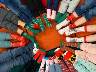 Kindergarten Sock Day was a huge success.  They called them their "service socks".  Each time they wear them it will remind them to serve and be kind.  They learned that they can save the world.    Kindergarten also celebrated the first day of winter )which is the longest day of the year) by wearing their pajamas and making ornaments to feed the birds.  Happy Winter Solstice!